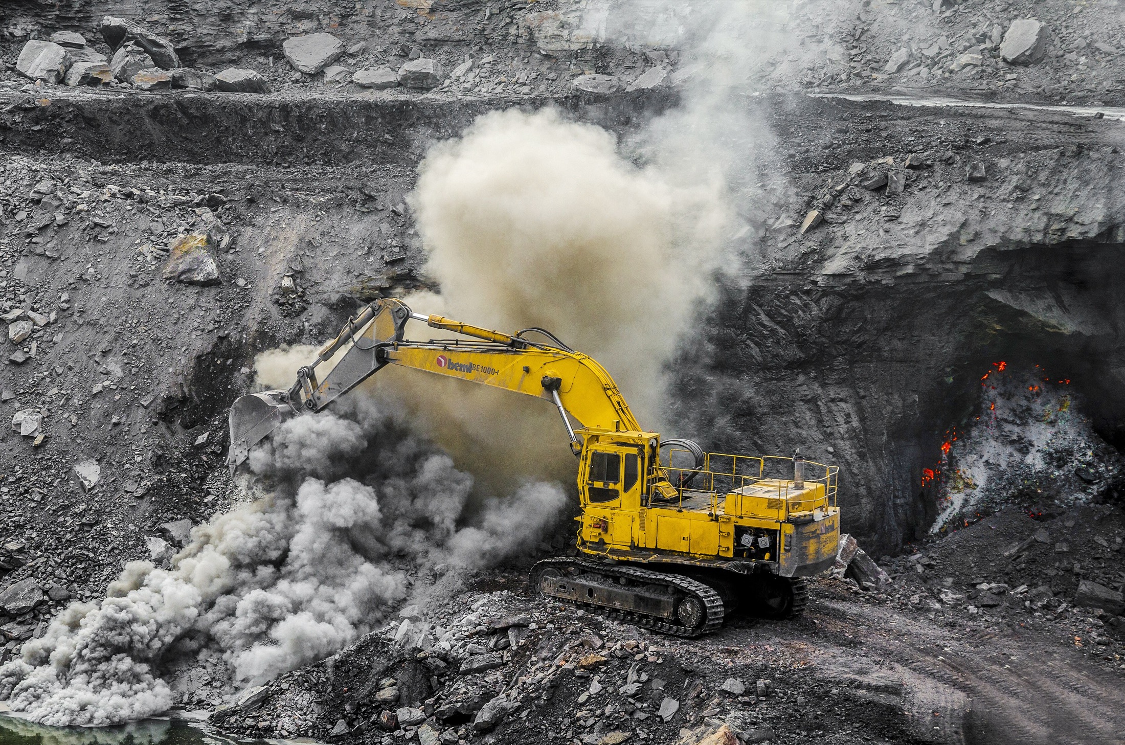 Open coal mine landscape with terraced excavation